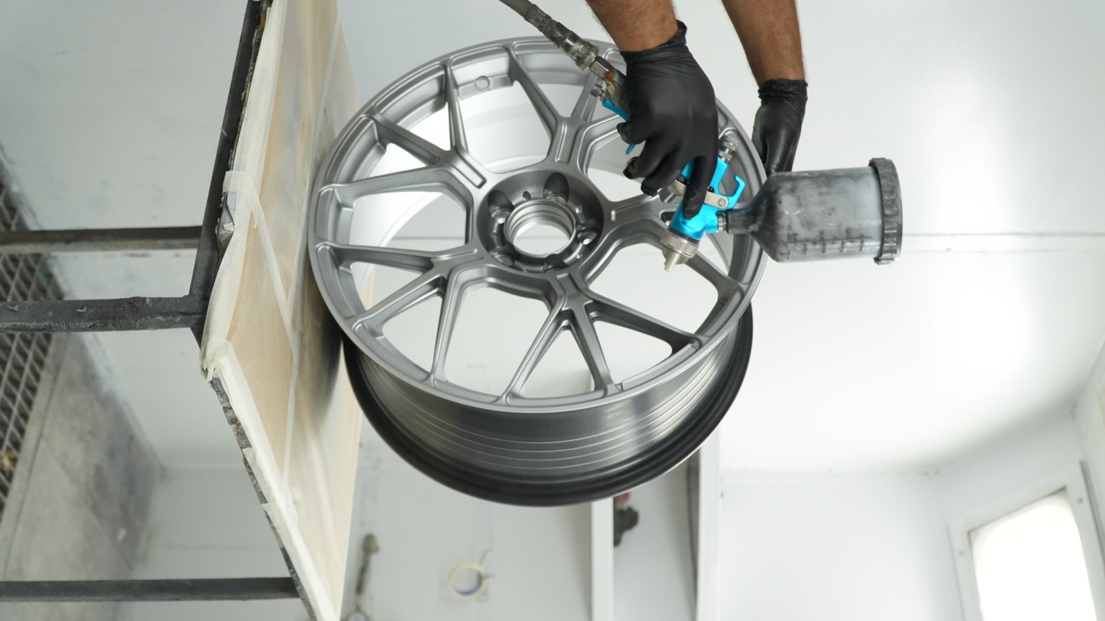 Wheels being refinished in the paint booth
