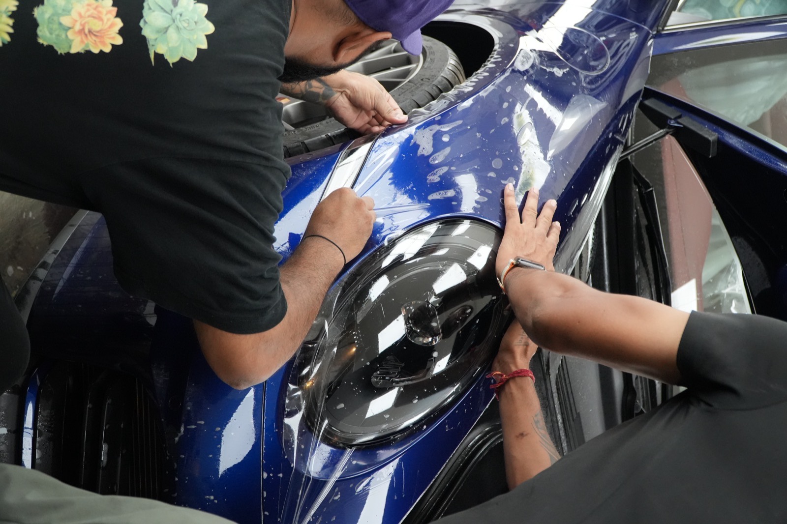 A vinyl wrap mid-application